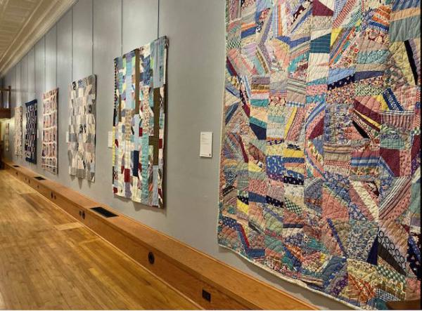 Wall of vintage quilts from collector Roderick Kiracofe